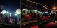 Viral! Warga Surabaya Gelar Pesta Pernikahan Mepet Rel Kereta Api, Netizen: Pelan-pelan Pak Sopir