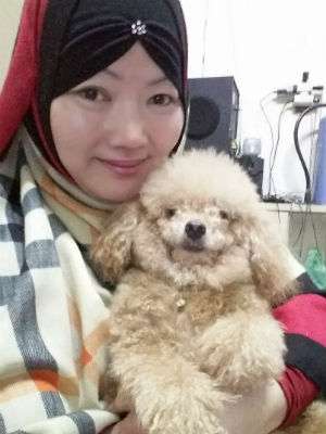 Muriati dan anjing peliharaannya