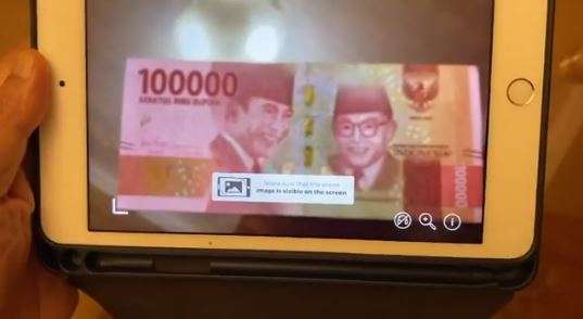 Scan uang Rp100 ribu