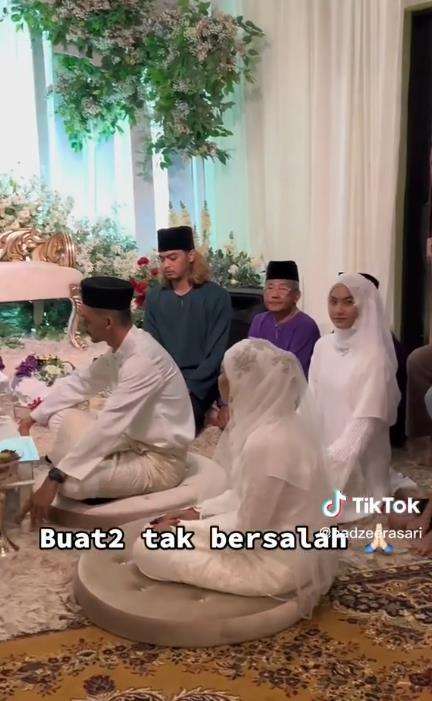Gadis dihujat pakai busana hampir mirip pengantin wanita.