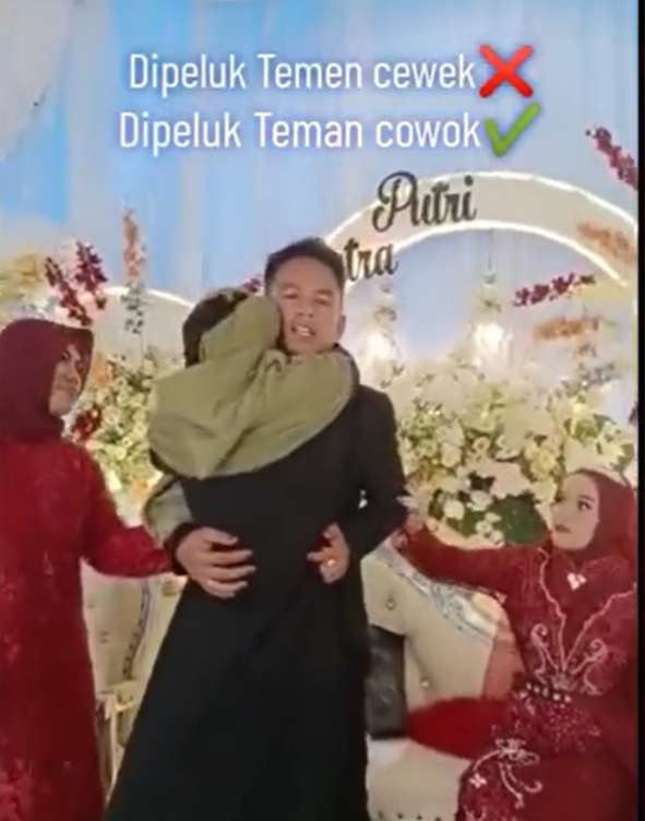 Wanita bercadar tiba-tiba peluk pengantin pria