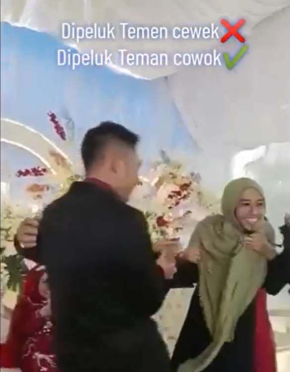 Wanita bercadar tiba-tiba peluk pengantin pria