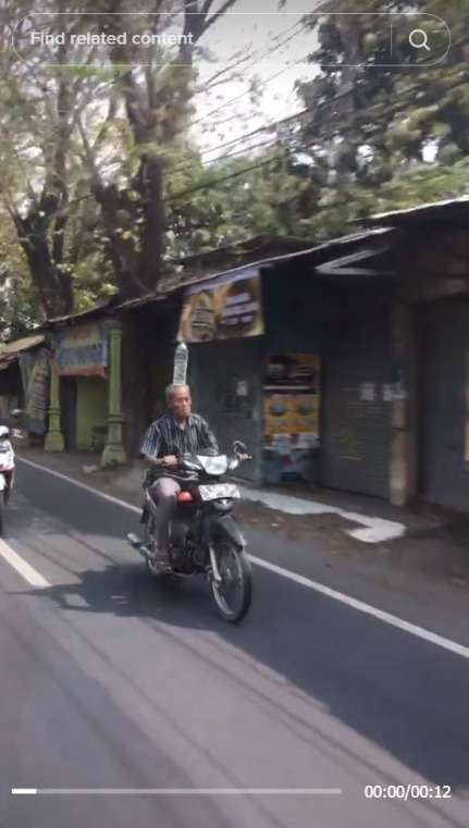 Viral Bapak-Bapak Unjuk Kebolehan, Bawa Botor di Atas Kepala Sambil Naik Motor di Jalan