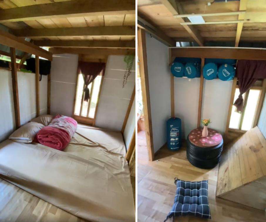 Rumah panggung di tengah hutan.