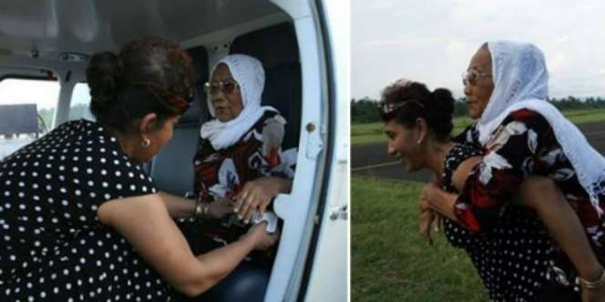 Sosmed Heboh Foto Menteri Susi Gendong Ibu Tua Naik Pesawat