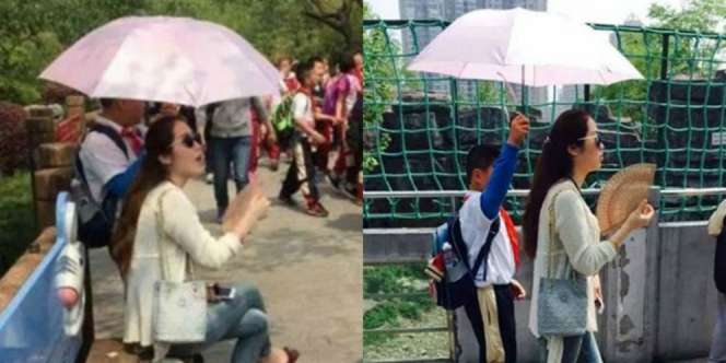 Heboh, Guru Jadikan Murid `Ojek` Payung Pribadi