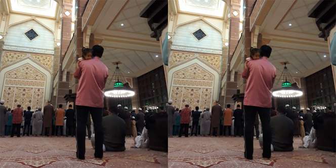 Subhanallah, Ayah Sholat Tarawih Sambil Gendong Putrinya