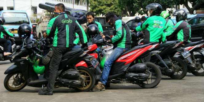 Merger Grab-Uber Berbuah Denda Rp141 Miliar di Singapura