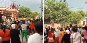 Heboh Satu Keluarga Sebar Uang dari Atap Rumah