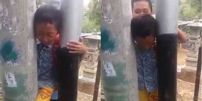 Duh Kasihan, Bocah Ini Nangis Kejer karena Kepalanya Kejepit Tiang Listrik