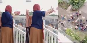 Viral Video Emak-Emak Sebar Uang dari Atas Loteng, Asli atau Konten Doang?