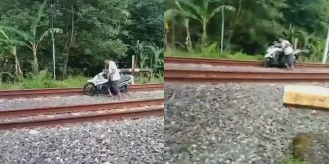 Video Detik-Detik Seorang Pria Nekat Dorong Motor di Atas Rel, Nyaris Tersambar Kereta
