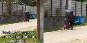 Ibu dan Anak Berbagi Payung Susuri Jalan Berdebu di Bawah Terik Matahari, Kisah di Baliknya Bikin Terharu